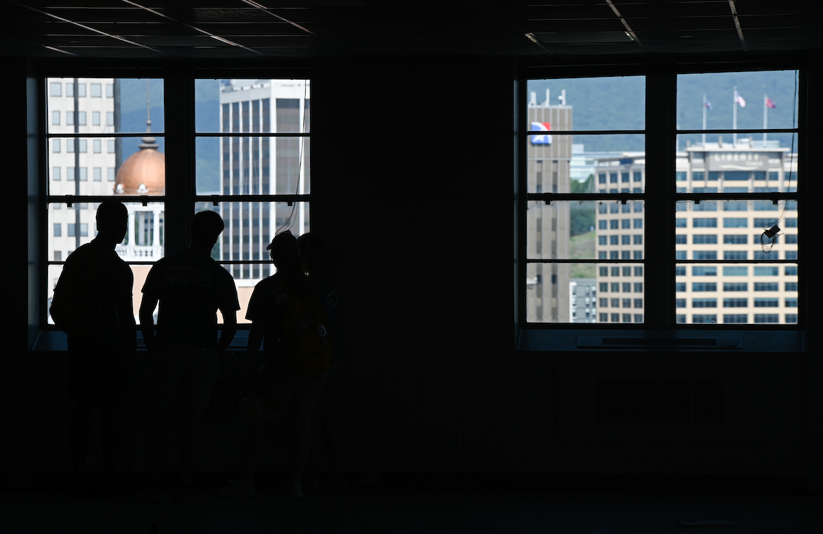 Moc Up participants look out the window during a tour of 540 McCallie, also known as the State Building.