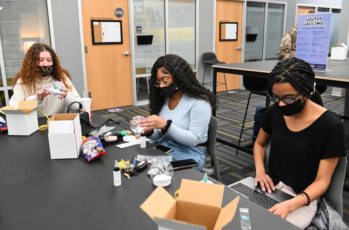 Students make snow globes during Winter Welcome.