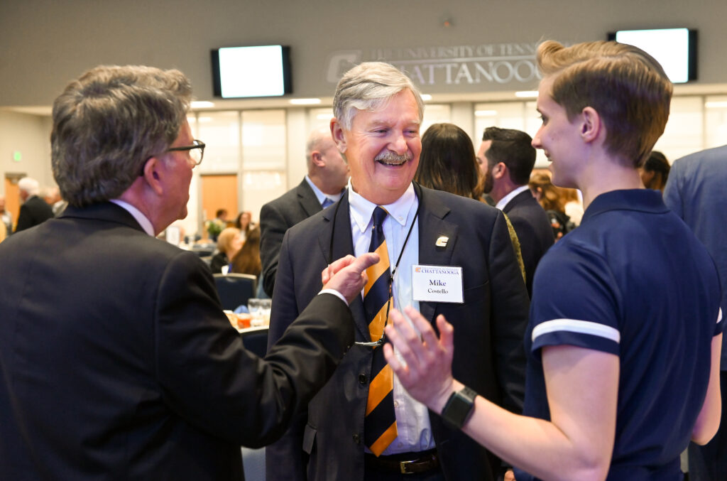 Mike Costello, center, attended the University’s annual Scholarship Luncheon on March 1. Photo by Angela Foster.