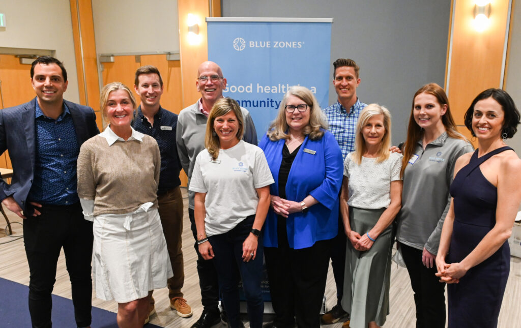 Dan Buettner Jr., far left, vice president of business development for Blue Zones, and members of the Chattanooga Blue Zones steering committee: Hollie Brock (advocate for Chattanooga), Michael Walton (executive director of green|spaces), Bill Rush (CEO of Metropolitan Ministries), Megan Vermeer (director of health innovation at YMCA of Metropolitan Chattanooga), Rae Bond (executive director at Chattanooga-Hamilton County Medical Society), Dr. Steven Fox (Erlanger Health System), Chrissie Smith (registered nurse and certified health coach at True Health Journey), Emma Sampson (program manager, UTC Master of Public Health Program), Dr. Suzanne Bozzone (True Health Journey). Photo by Angela Foster.