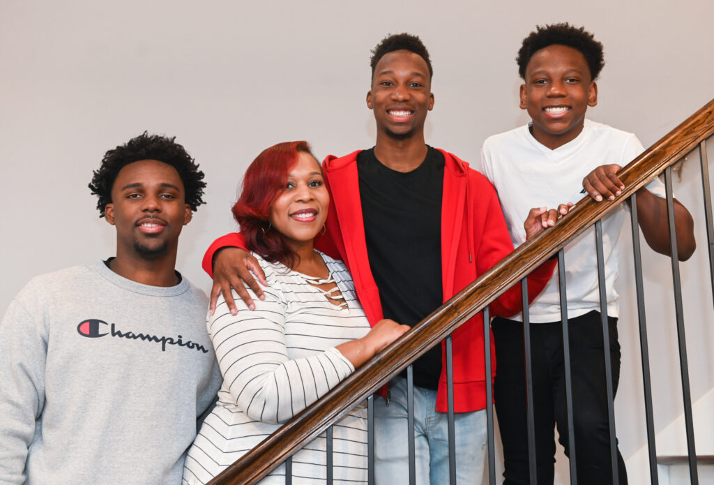 Christina Culbreath, a member of the UTC BAS-AL program for adult learners, at home with sons (from left) Jaden, Jasen and Jacob. Photo by Angela Foster.