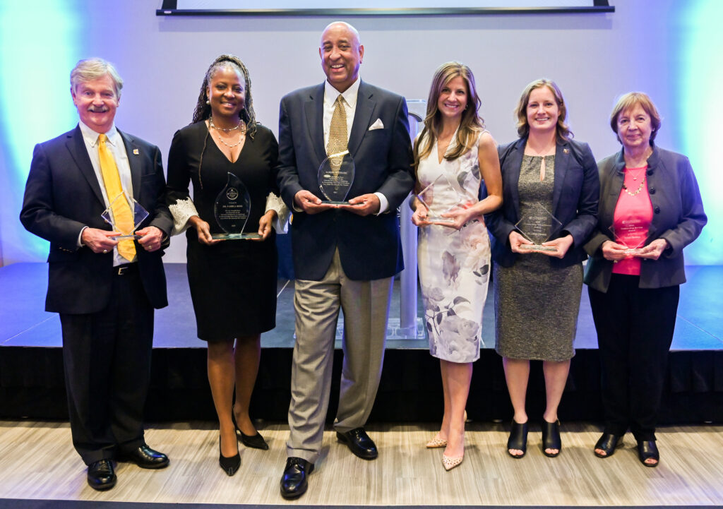 The Legends and Leaders award dinner took place April 7, 2022. From left: Mike Costello, Dr. Pamela Ross, Albert Woodard, Erika Milczek, Lindsey Cochran and Judith Buhrman—who accepted on behalf of her late husband, Richard Buhrman. Photo by Angela Foster.