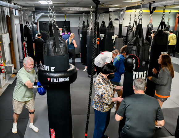Parkinson's fighters hard at work under the watchful eye of Grace Sanford, far right.
