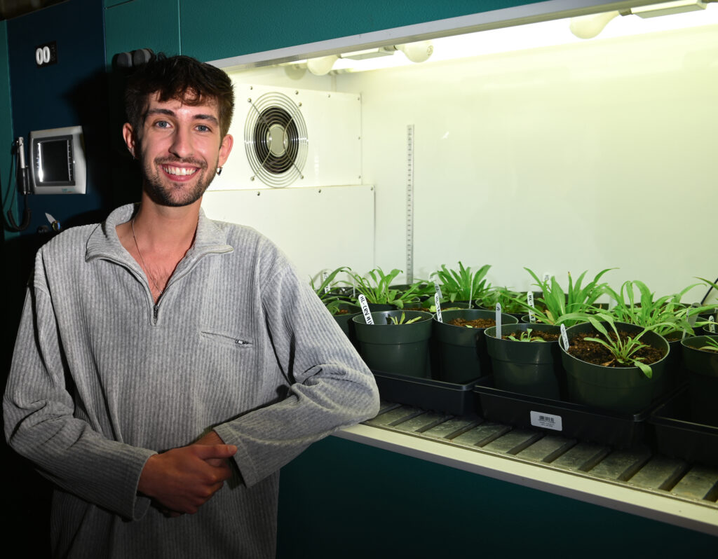 UTC graduate student Thomas Wiegand in the Plant Ecology Lab in Grote Hall. Photo by Angela Foster.