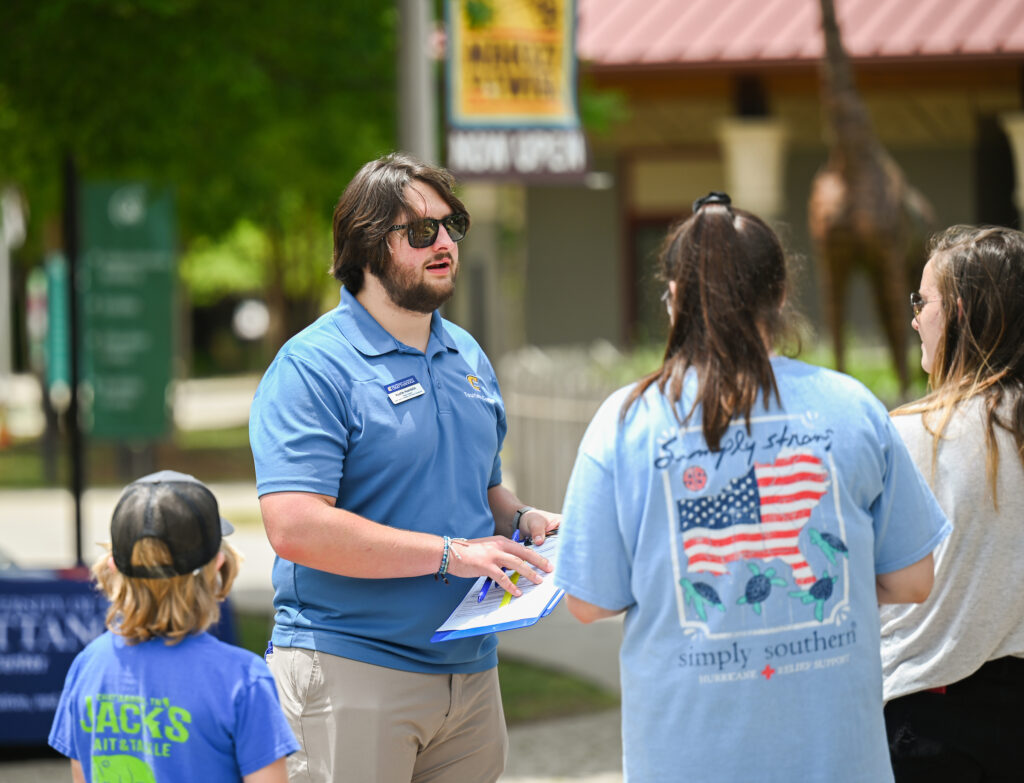 UTC senior Austin Hamblin talks to Chattanooga Zoo visitors.