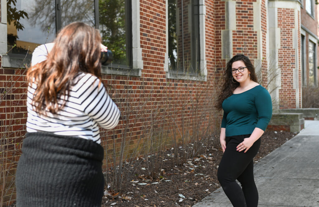 Lawyer-turned-photographer Paige Ivey Evatt snaps pictures of Autumn Lester outside of Brock Hall during a Women’s History Month event sponsored by the Center for Women and Gender Equity. Photo by Angela Foster.