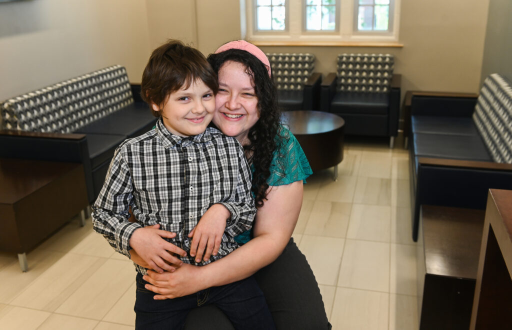 Katherine Sherman can often be found on campus accompanied by her son, Liam. Photo by Angela Foster.