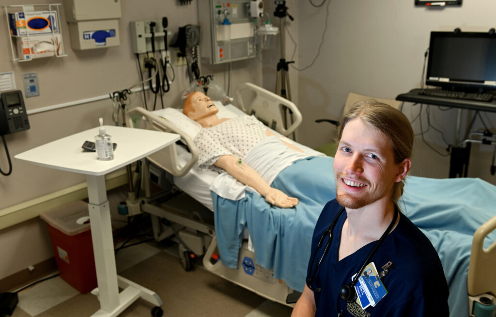 Nursing student Matthew Lewis will move into a full-time position in the intensive care unit at Erlanger Hospital after commencement. Photo by Angela Foster.