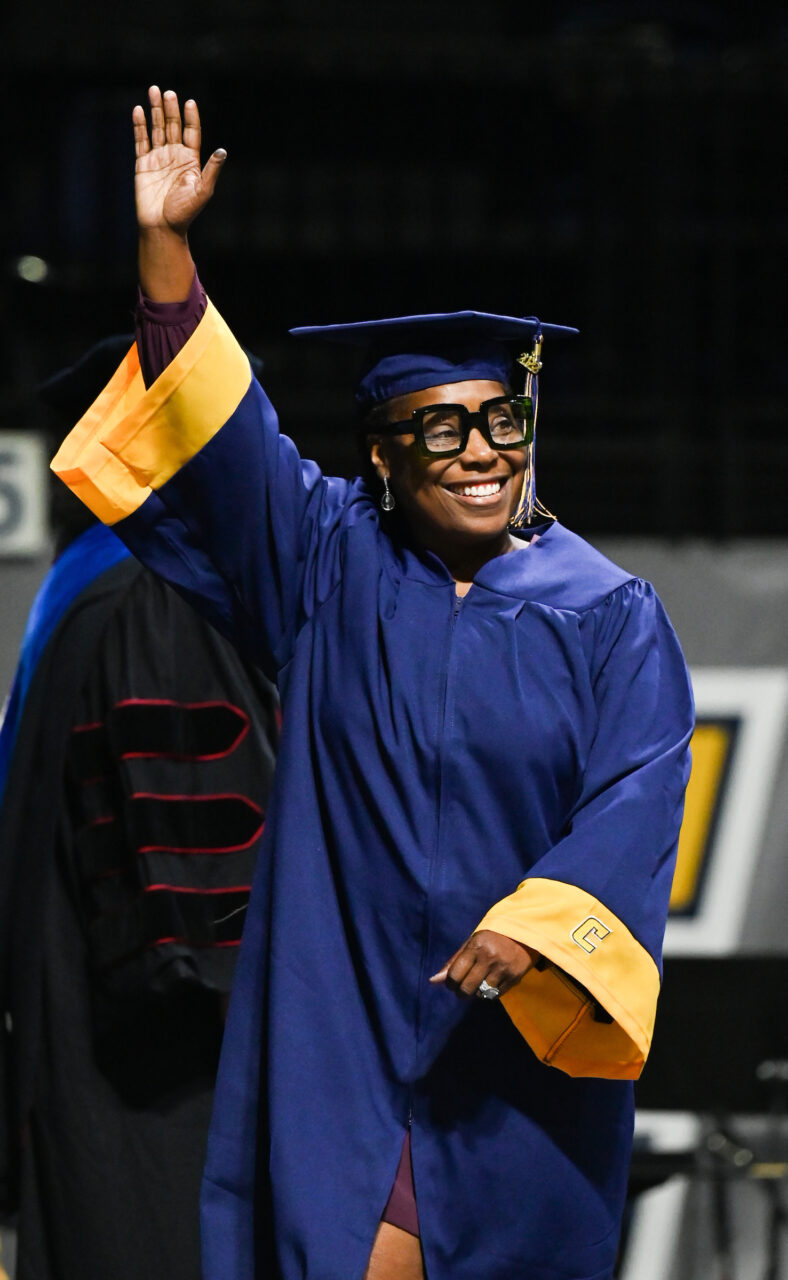 Councilwoman Demetrus Coonrod walks across the stage during the first of four undergraduate graduation ceremonies Saturday, May 7, 2022 in McKenzie Arena at the University of Tennessee at Chattanooga.Undergrad graduation, ceremony 1 of 4, Friday, May 6, 2022 in McKenzie Arena.