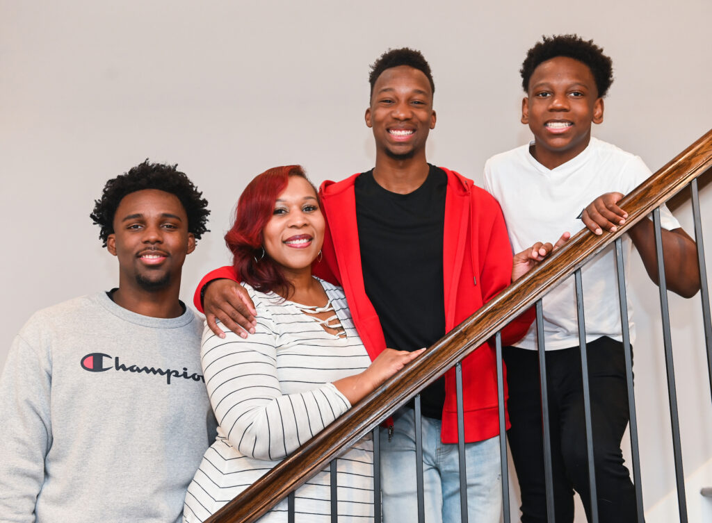 Jaden, (gray), Jacob, (white) and Jasen, (red), pose with mother, Christina Culbreath, Monday, Feb. 21, 2022 in their Ooltewah home.