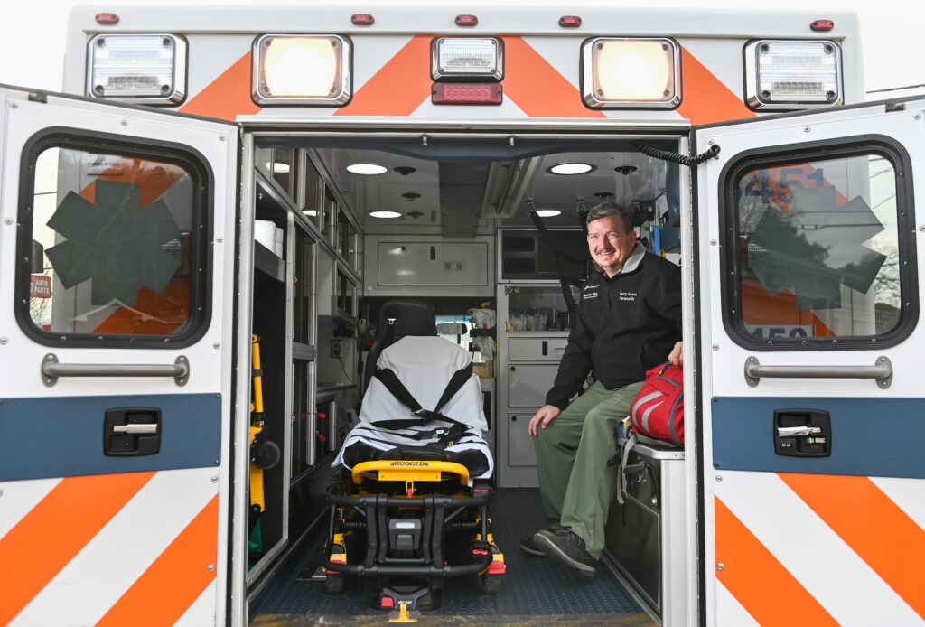 Paramedic Larry Guess sits Monday, Feb. 21, 2022 in an ambulance at the Kimball station.
