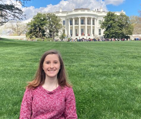 December 2021 graduate Nicki Messer, now a congressional staff assistant, stands in front of the White House