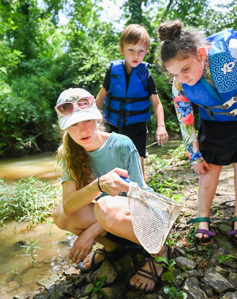 Casey Kennedy shows campers what can be found in South Chickamauga Creek at the WaterWays camp in Audubon Acres.