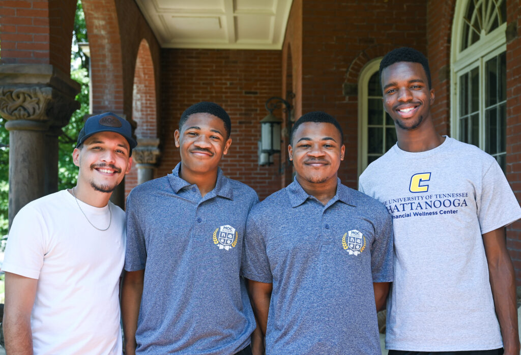 From left: UTC student mentor Juan Aponte, incoming first-year students Alvin and Albert Bolden, mentor Donald Webb.