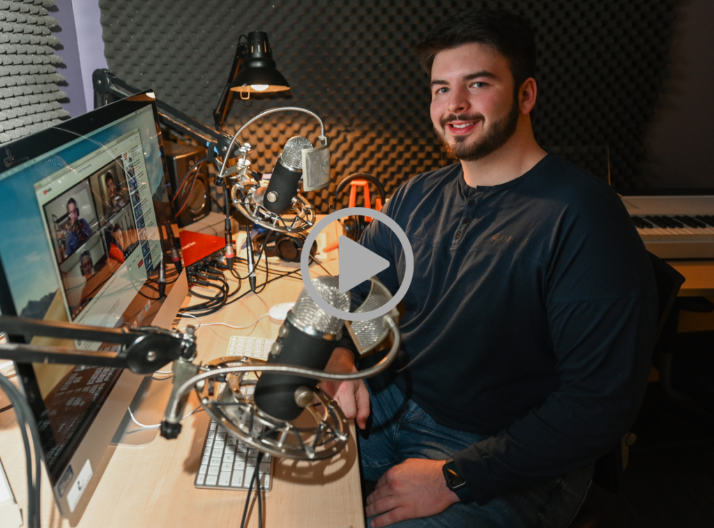 Ian Cushing sits Thursday, Feb. 17, 2022 in the Library podcast studio.