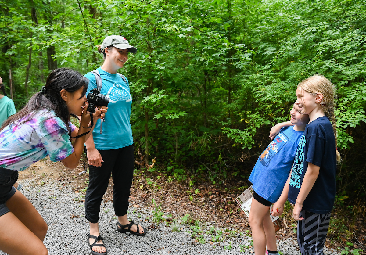 Campers pose for Serretta Malaikham while Kristen Woodall looks on.