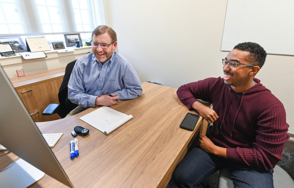Chris Bogans, right was mentored by UC Foundation Professor of Management Frank Butler as part of a UTC Undergraduate Research and Creative Endeavor program. Photo by Angela Foster.