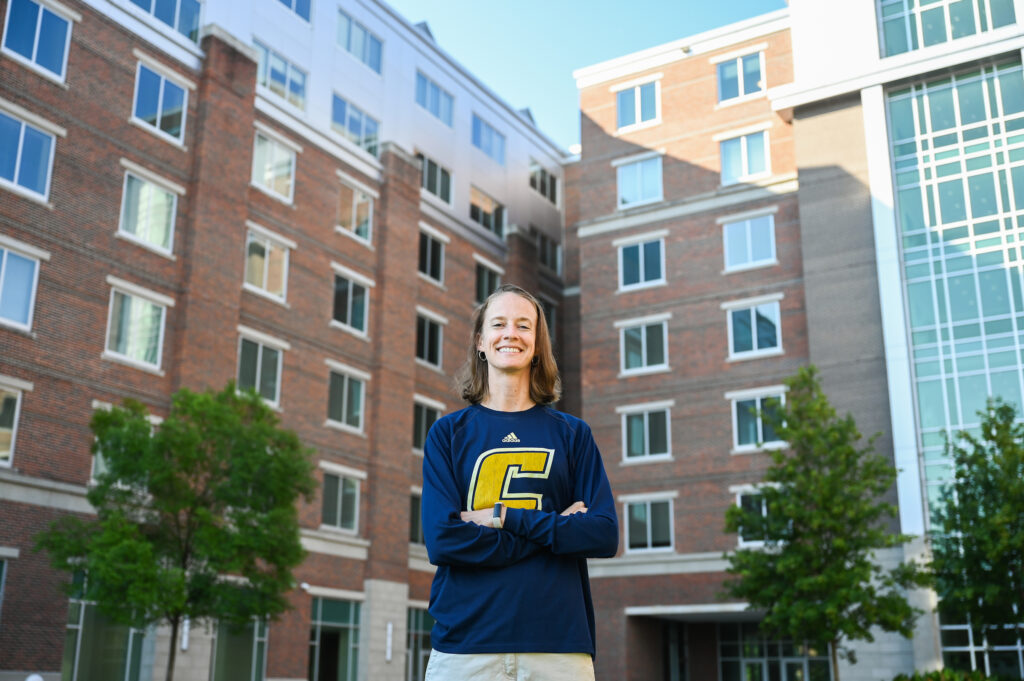 Liz Hathaway, standing in front of West Campus housing, said she was drawn to the West Campus faculty in residence post because “I specifically wanted a predominantly freshman dorm."