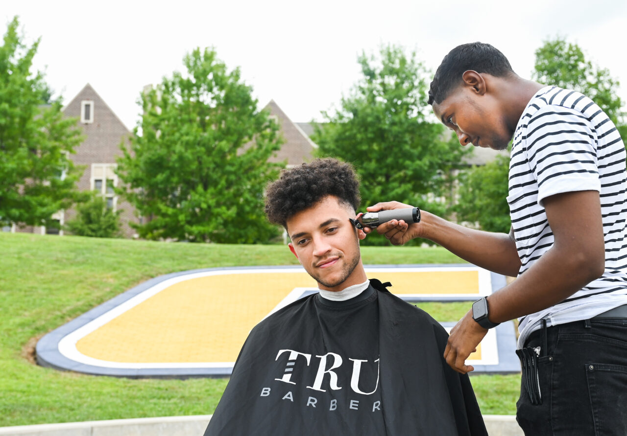 Haircut, Wednesday, Aug. 24, 2022 Student getting haircut, barber is his roommate