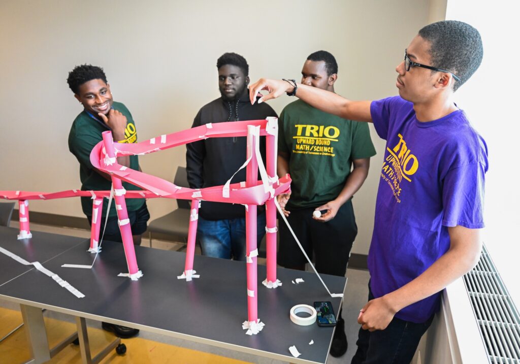 Gino Appleberry Jr., left, is a recent UTC graduate with a degree in psychology. He served as a teaching assistant during the summer Upward Bound Math Science PRISM classes. Photo by Angela Foster.