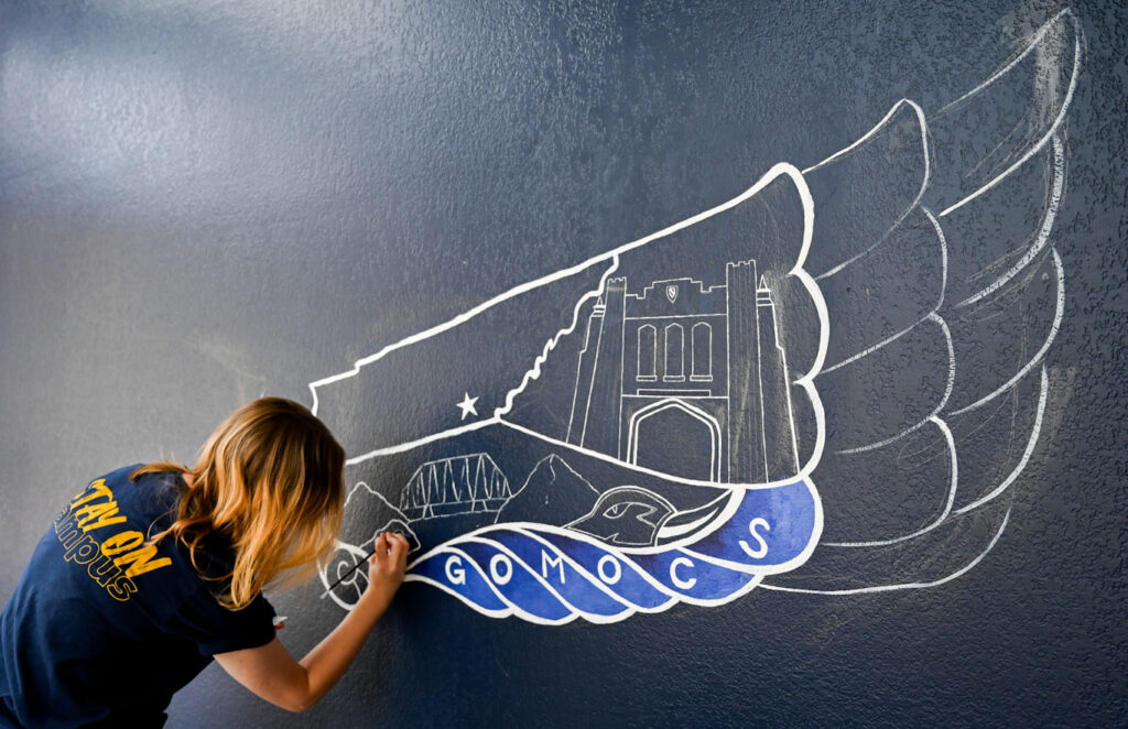 Corinna Lingle worked on her mural during the summer. "I just enjoy making the artwork," she said. "If people take pictures by it, that's awesome. That's really great."