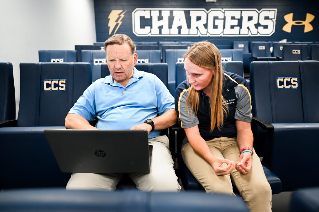 Gary Wilkerson, left and Shellie Acocello from the UTC graduate athletic training program worked with Chattanooga Christian School athletes at the school gym in July.