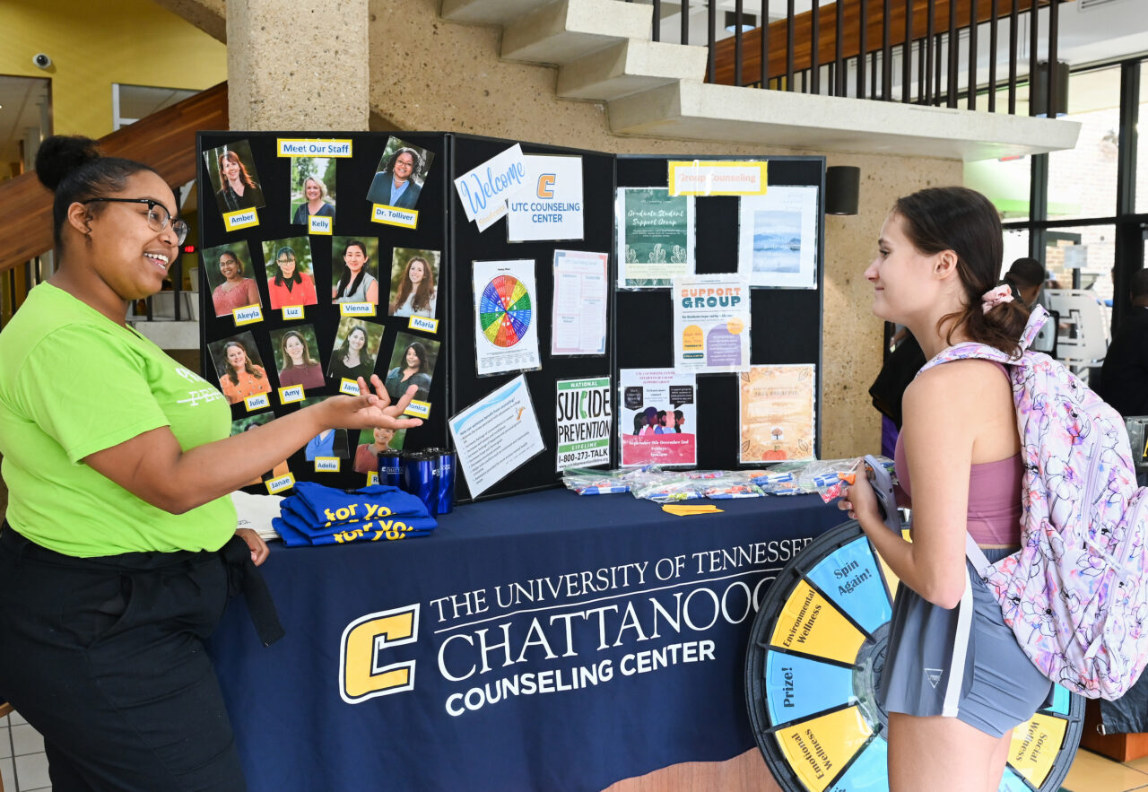 Akeyla Madison talks with students during the Wheel of Wellness event Tuesday, Aug. 23, 2022