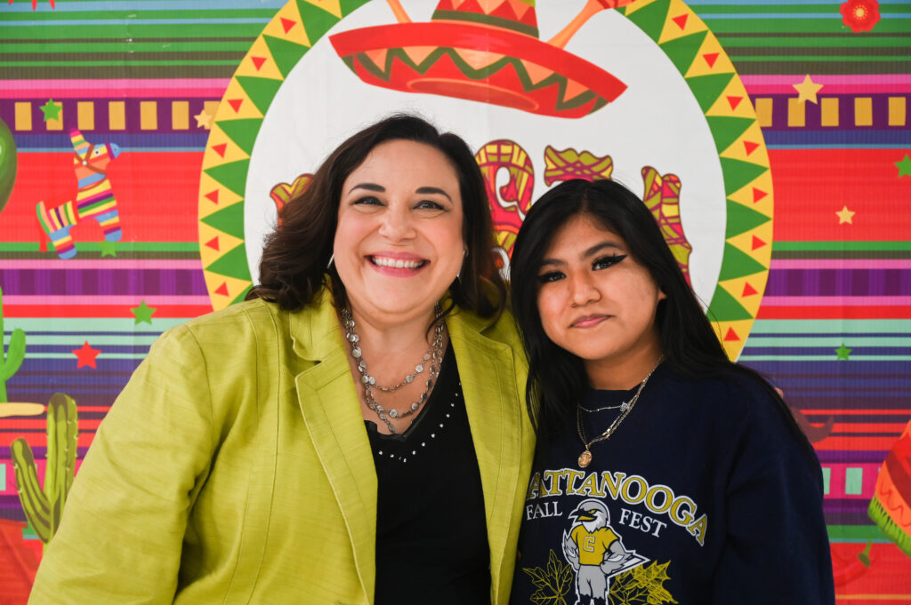 Niky Tejero, the Frances Hall Hill Professor of Music and associate dean of the UTC College of Arts and Sciences, left, and senior Magdalena Perez at the Hispanic Heritage Month kickoff on Sept. 15 in Lupton Hall. Photo by Angela Foster.