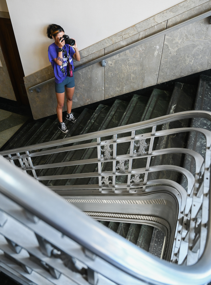 UTC student KiAna Queener takes photos inside Chattanooga's Joel W. Solomon Federal Courthouse.