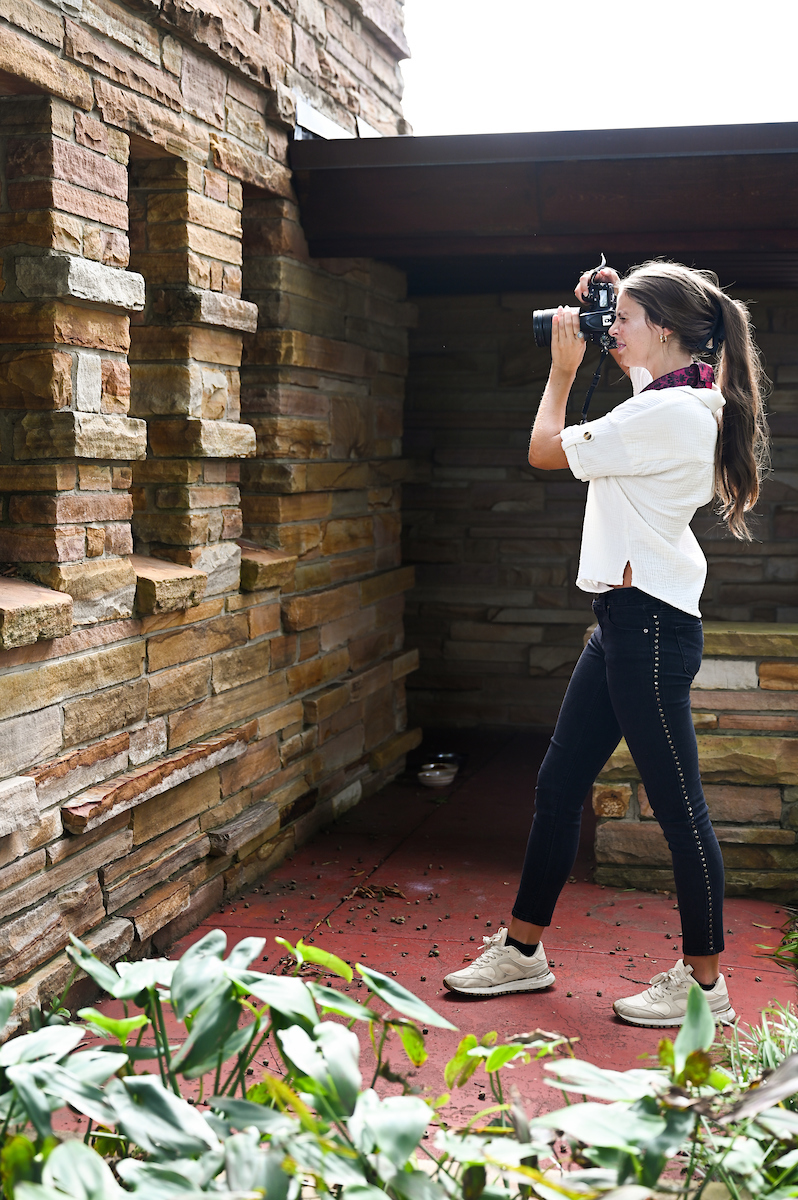 Historic preservation student Kristin Donnell photographs the outside of a Missionary Ridge home designed by by world-famous architect Frank Lloyd Wright.
