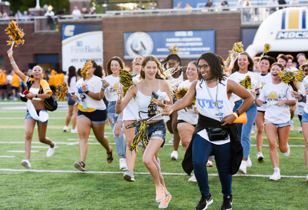 Prior to the opening kickoff, UTC freshmen and sophomores get to run across the Finley Stadium field during the annual Mocs Flock Finley event. Photo by Angela Foster.