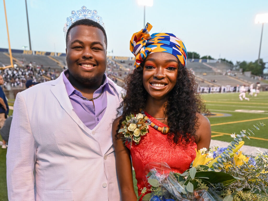 Isaiah Owens and Delali Gadzekpo stand in Finley Stadium after being crowned Homecoming King and Queen. Photo by Angela Foster.