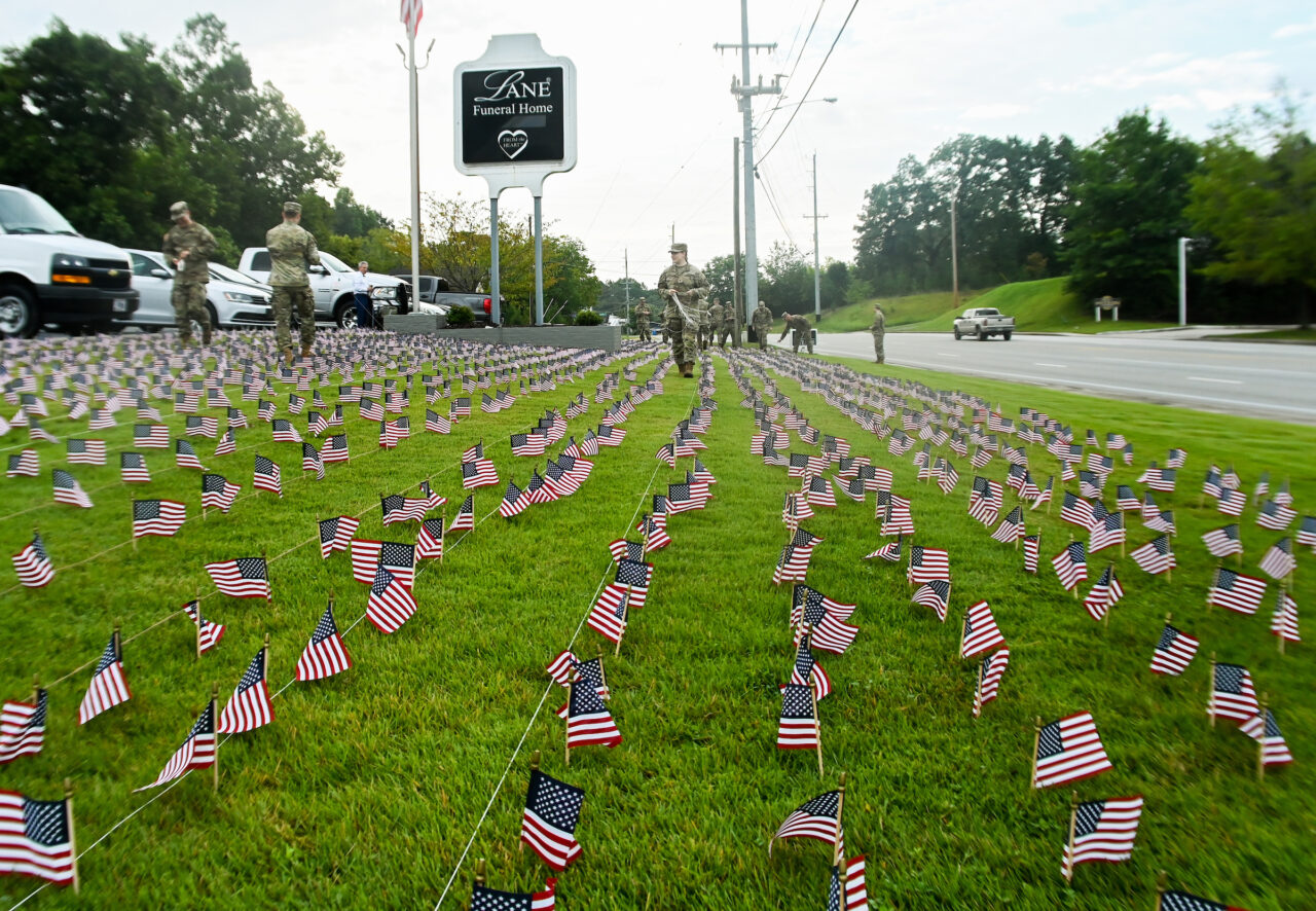 University of Tennessee at Chattanooga ROTC members place 2000 flags in front of Lane Funeral Home on Ashland Terrace, Wednesday, Sept. 7, 2022 in honor of 9/11.