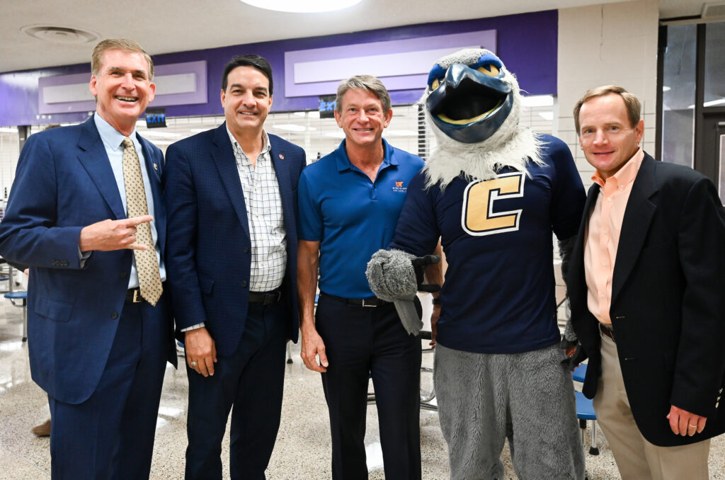 UTC Chancellor Steve Angle, left, Tennessee Rep. Greg Martin, UT System President Randy Boyd, Scrappy and Jimmy Rodgers of the Summers, Rufolo and Rodgers law firm at the UT Promise event Tuesday, Sept. 13, 2022, at Central High School. Photo by Angela Foster.