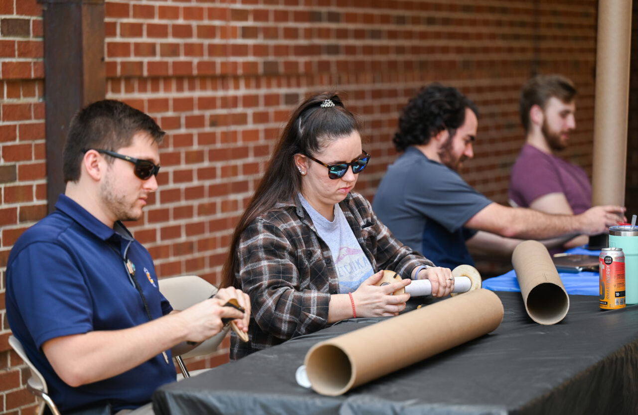 2023 NASA USLI Rocket Mocs Team members work Friday, Oct. 7, 2022 outside of the ECS building on their certification rockets in preparation for their competition.
