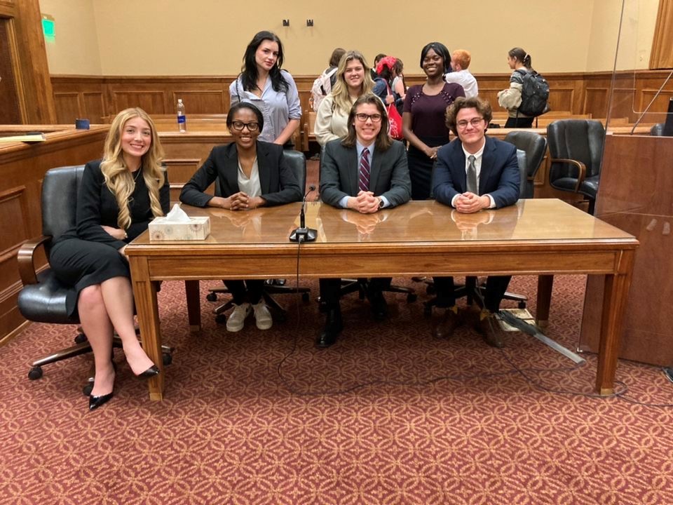 UTC Mock Trial gold team at the Grand Ole Tournamet. Top row, from left: Catherine Corcoran, Ava Carter, Comfort Senu. Bottom row: Savannah Simpson, Lauren Igoni, Sam Kline, Justin LaPorta. Photo courtesy of Mike Giglio.