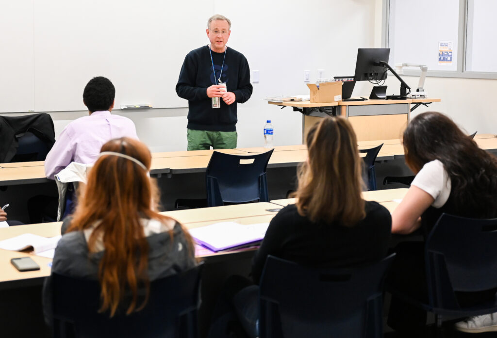 Chattanooga Times Free Press columnist Mark Kennedy, speaks to high school students during a communications workshop at UTC's Lupton Hall.