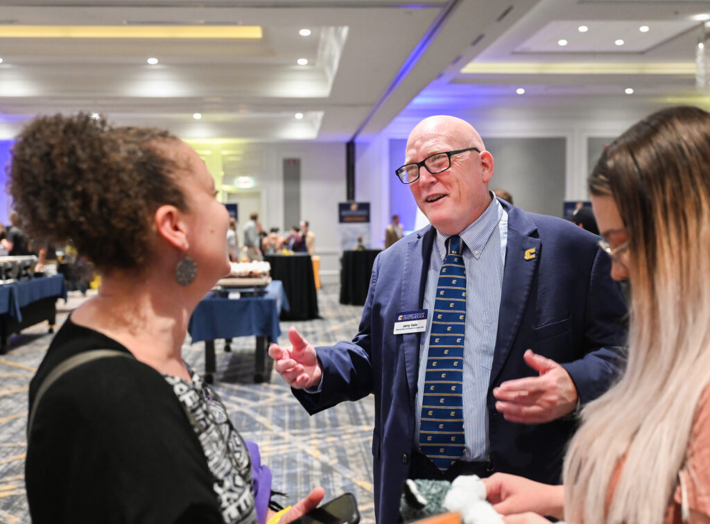 Provost Jerold Hale talked with high school students and their parents at the recent UTC Road Trip: The Power C Tour event in Franklin, Tennessee. Photo by Angela Foster.