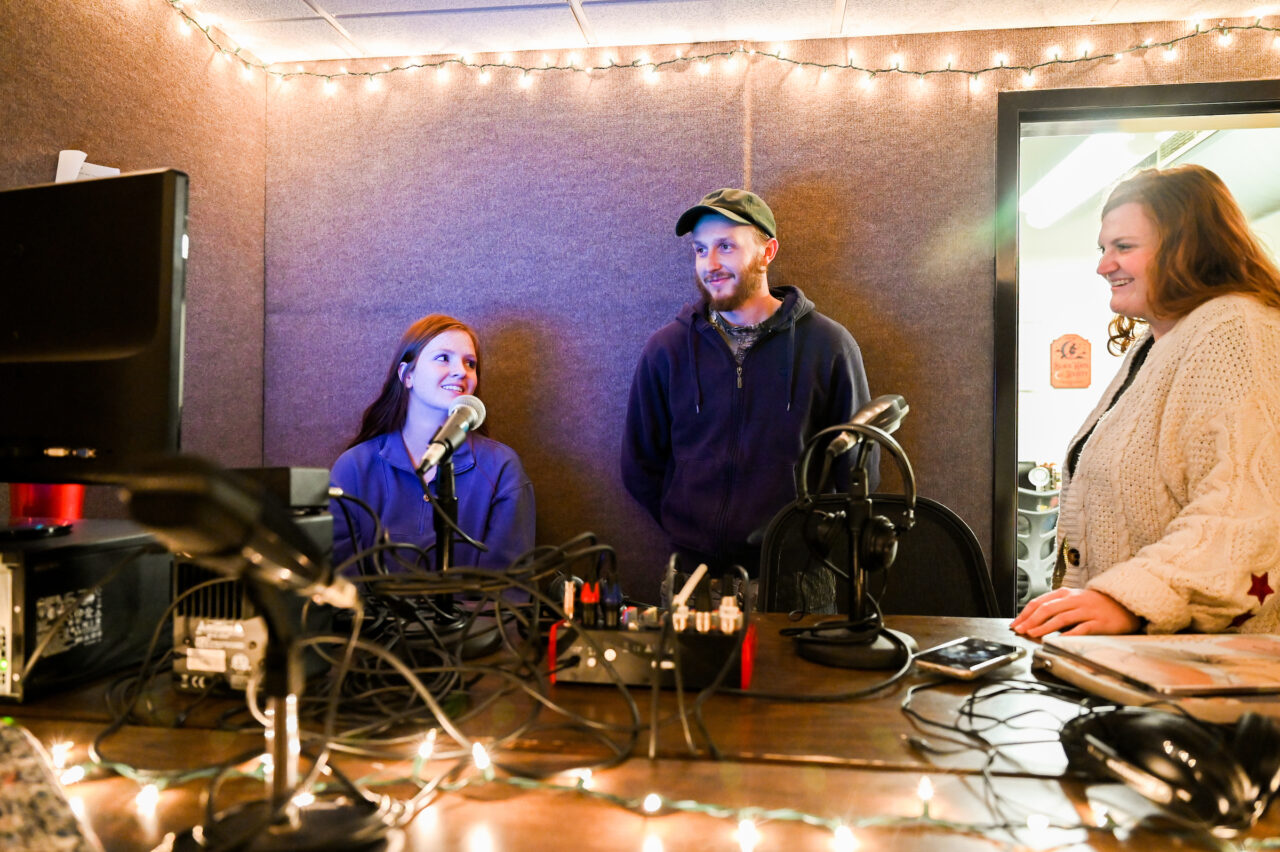 Perch students Breanna Powers, left, Ryan Mench and Hannah Engelbrecht in the station's University Center studio. Photo by Angela Foster.