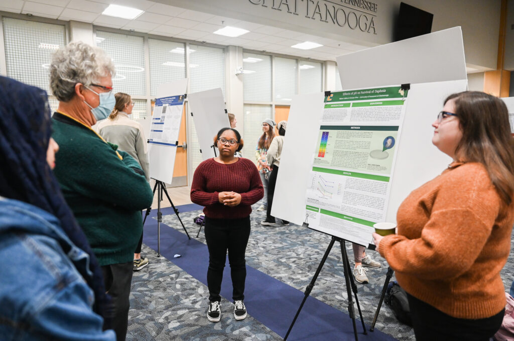 Ermaya Wise, left, and Skylar Calkins present their poster titled “Effects of pH on Survival of Daphnia.” Photo by Angela Foster.