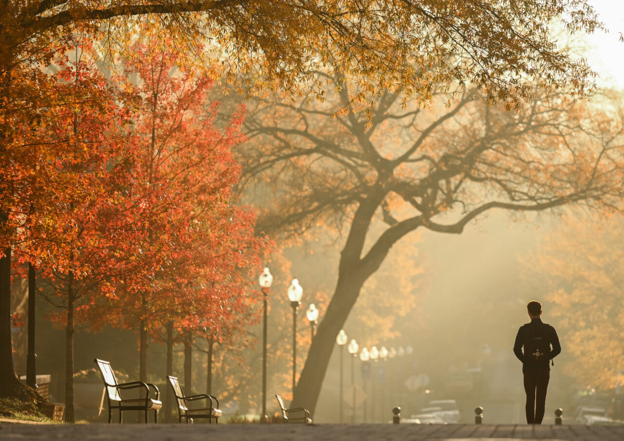 Students walk across campus through the fog Tuesday, Nov. 29, 2022 on Oak Street.