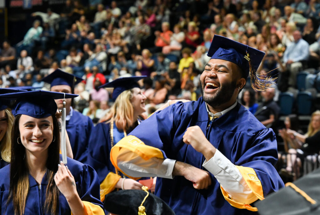 Otis Anthony celebrates during the first of four undergraduate graduation ceremonies Saturday, May 7, 2022 in McKenzie Arena at the University of Tennessee at Chattanooga.