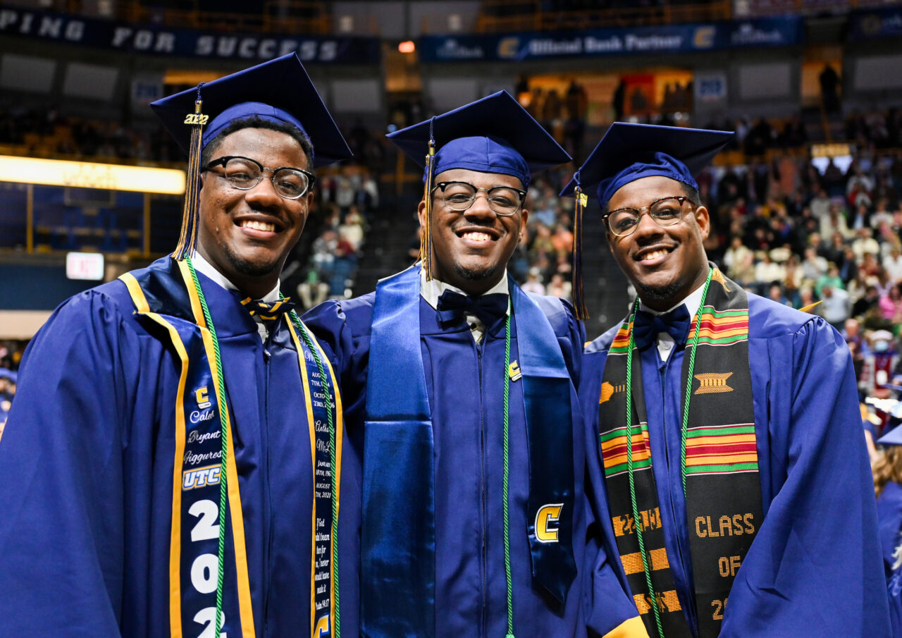 Caleb, Chauncey and Chris Figures stand before the undergraduate commencement, Saturday, Dec. 17, 2022 in McKenzie Arena.