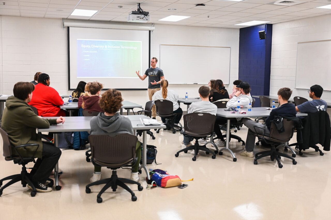 Craig Gosnell talks with freshmen students during an IGNITE program class on Friday, Jan. 13. Photo by Angela Foster.
