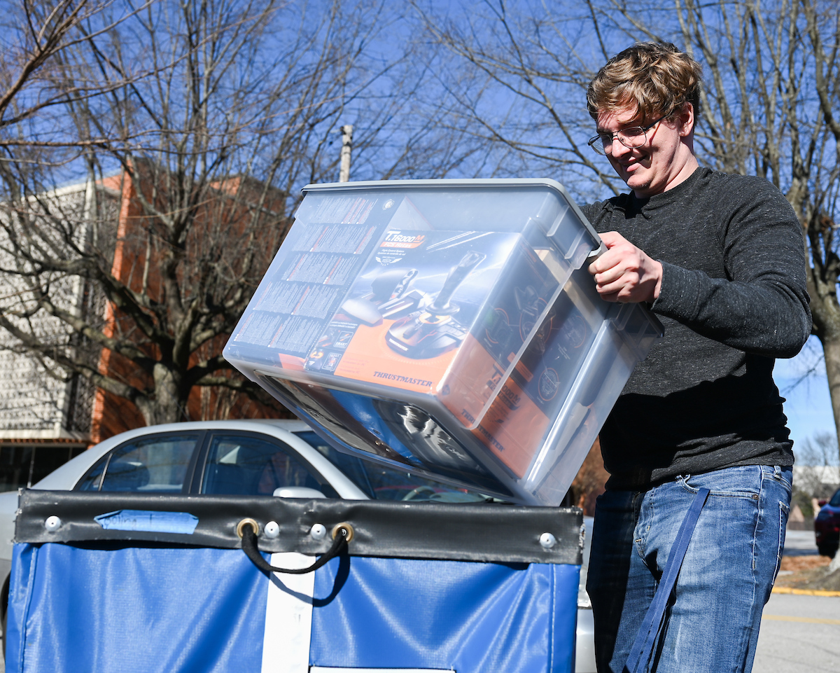 Thomas Becker has a full load to roll into his room in Johnson Obear Apartments 