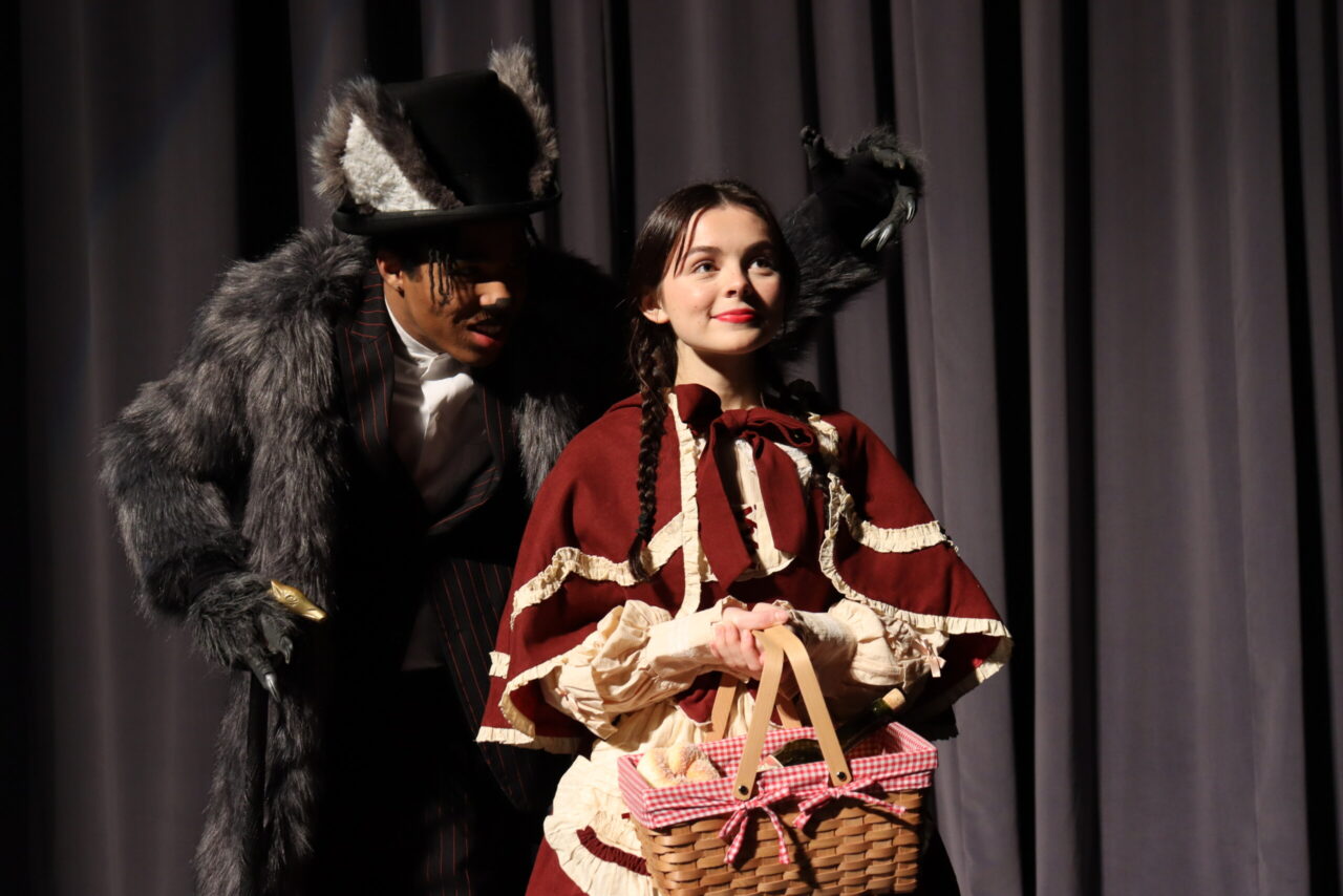 Liomar Mercedes Sosa (as Wolf) and Andrea Kelliher (as Little Red Riding Hood) are among the performers in "Into the Woods."