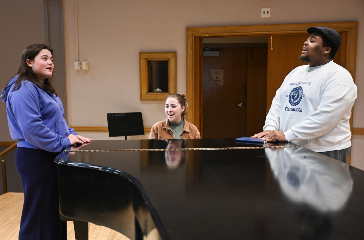 UTC students Brooke Harwell, left, Ashly Dilbeck and Isaiah Owens at a rehearsal for "The Sound of Music." Photo by Angela Foster.
