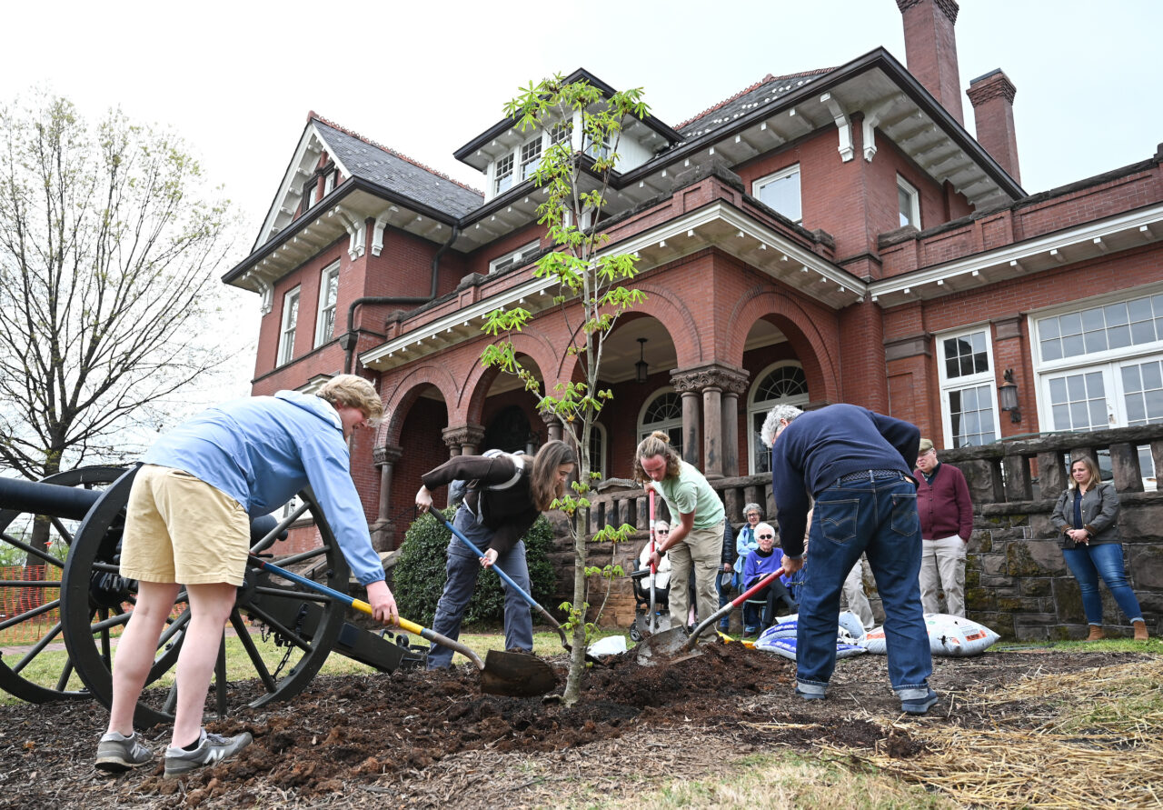 UTC Arbor Day celebration, Friday, March 31, 2023 in front of the Patten House. Hill Craddock, professor Students Nick Funk, green Zach Anderson, blue shirt Anesa Katana, dark shirt
