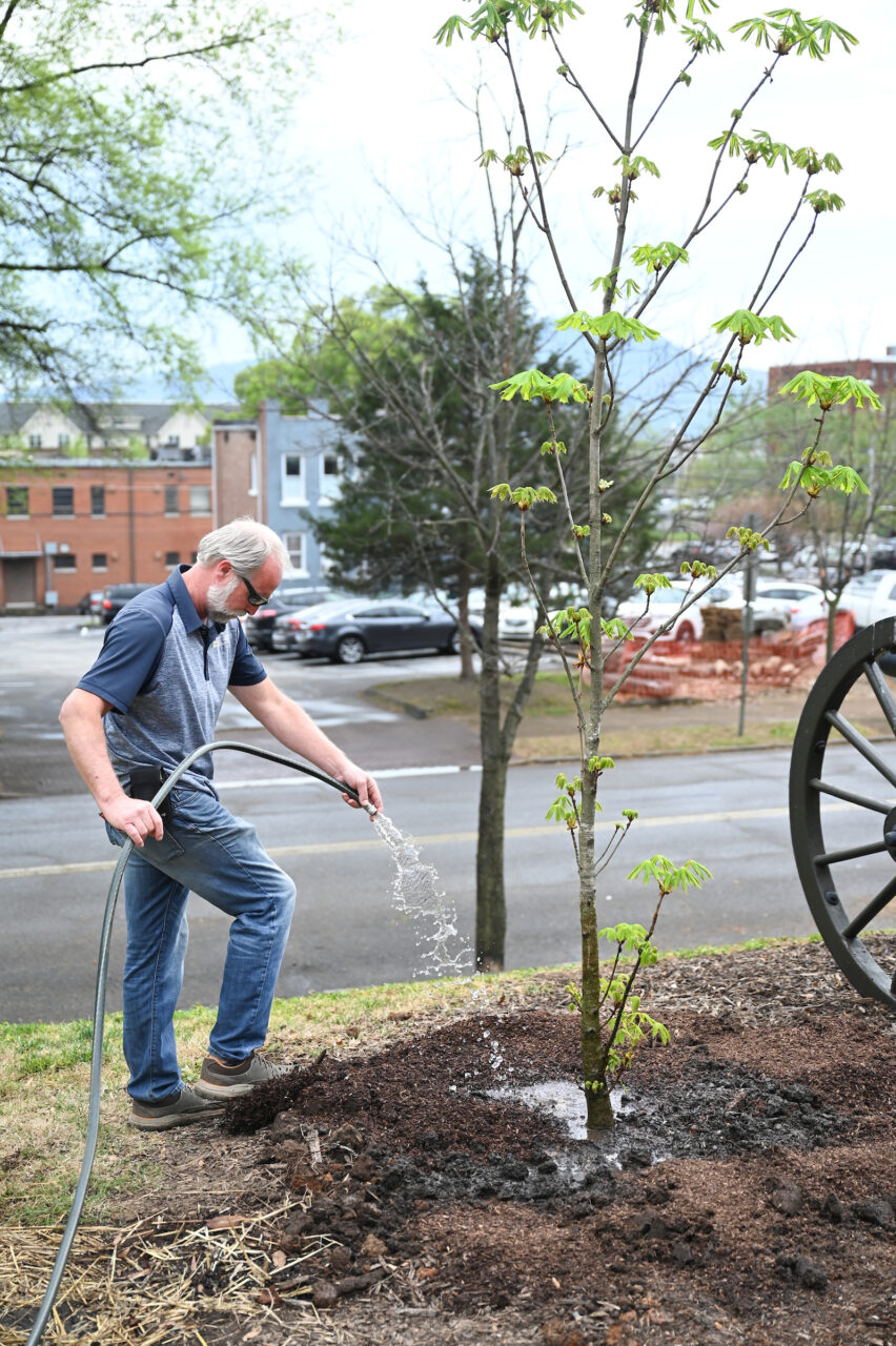 UTC Arbor Day celebration, Friday, March 31, 2023 in front of the Patten House. Hill Craddock, professor Students Nick Funk, green Zach Anderson, blue shirt Anesa Katana, dark shirt