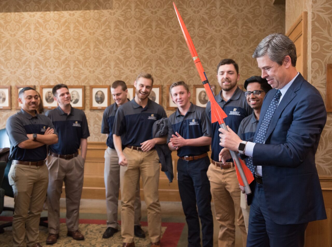 Ashwyn Sam, second from right and standing next to former Chattanooga Mayor Andy Berke, was a member of the Rocket Mocs team that set a national record in 2018.